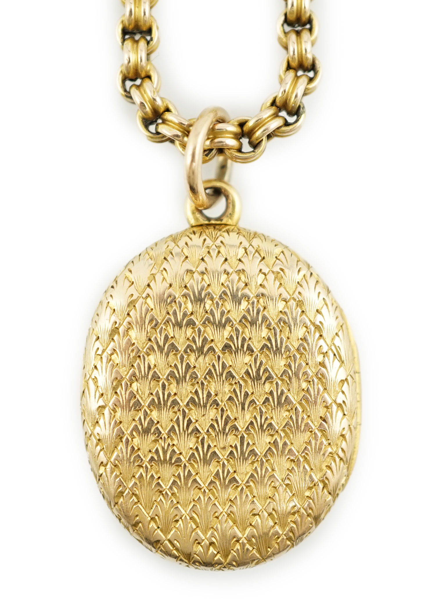 A late Victorian engraved gold oval locket, on a 10k chain